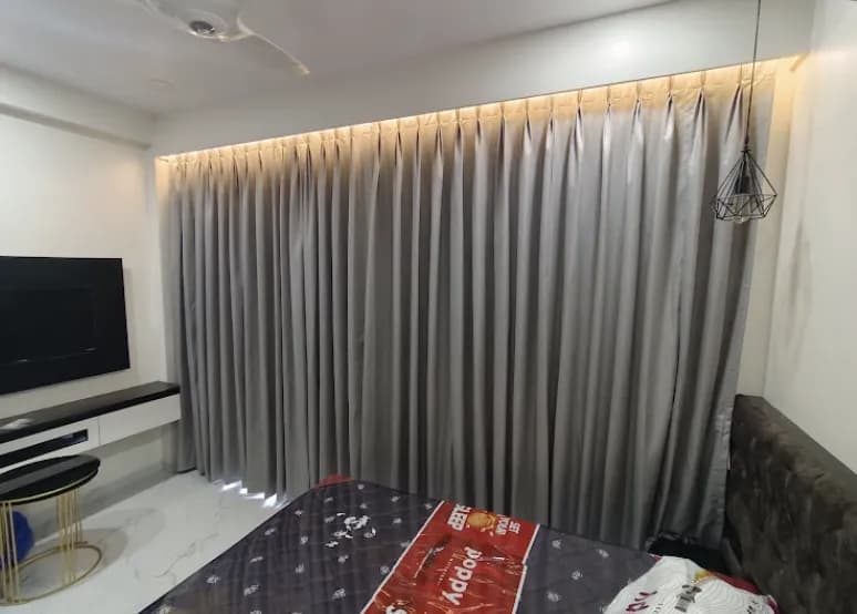 Solid Grey Blackout Pinch Pleat Curtains for a Vasco residence