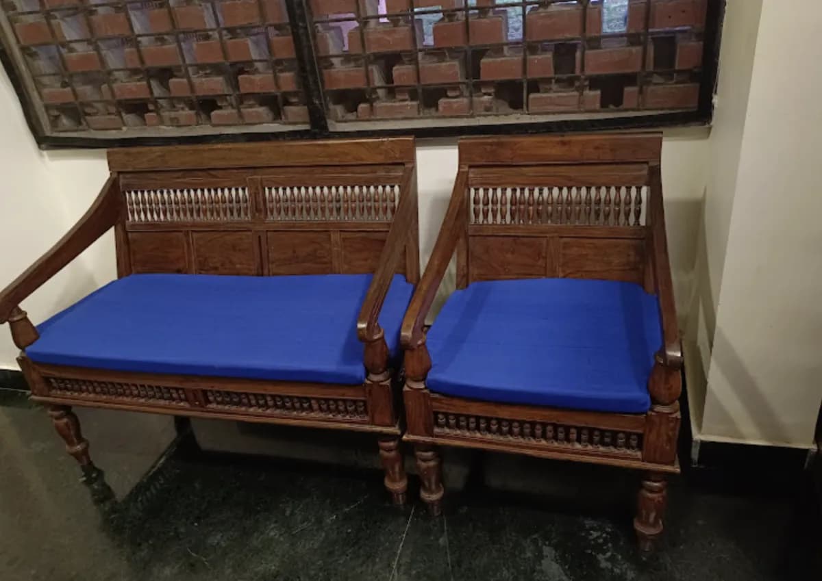 Antique Wooden Sofa with Blue Cushions tailored for Corlim homes