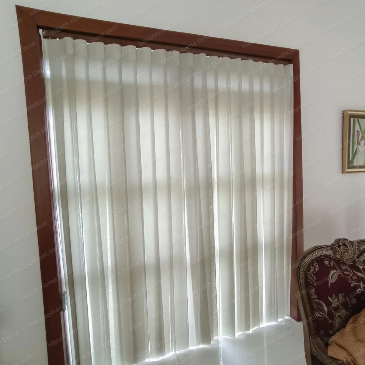 Ivory flexi curtain fitted inside the wooden frame of a tall living room window in Benaulim, Goa