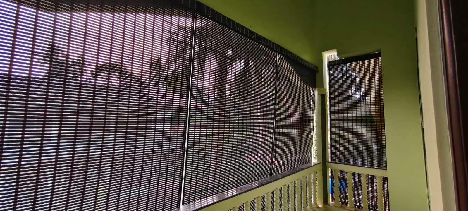 Close view of woven bamboo slats on a balcony blind