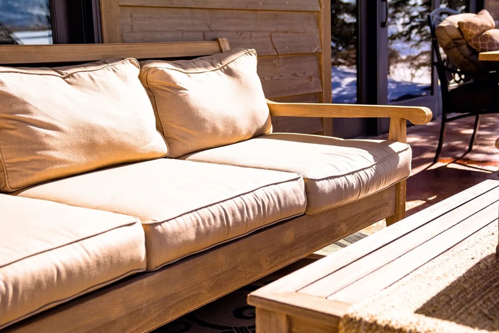 Thick seat and back cushions on a wooden-frame sofa
