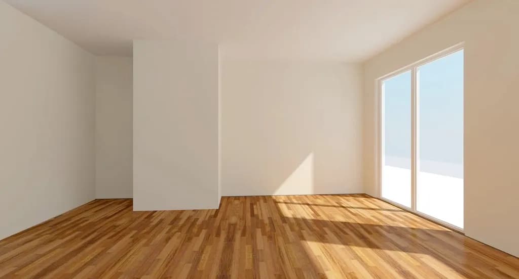 Empty room with a wood-look plank floor and sliding doors