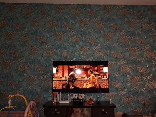 Luxury Teal and Gold Botanical Wallpaper Installed on Living Room TV Accent Wall in Margao Goa