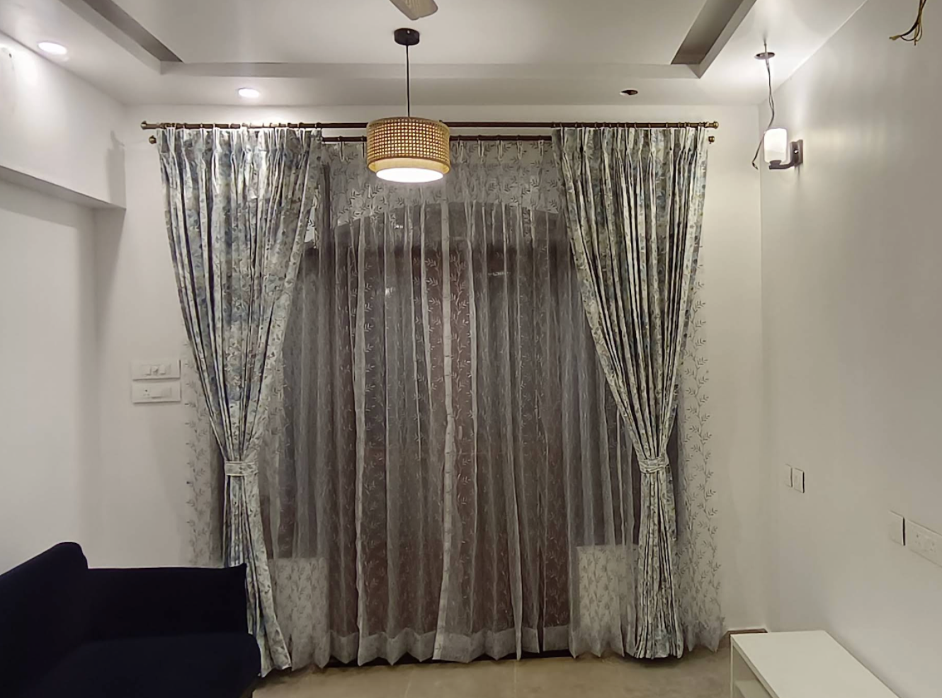 Floral Drapes with Sheer Curtains crafted for Goa interiors