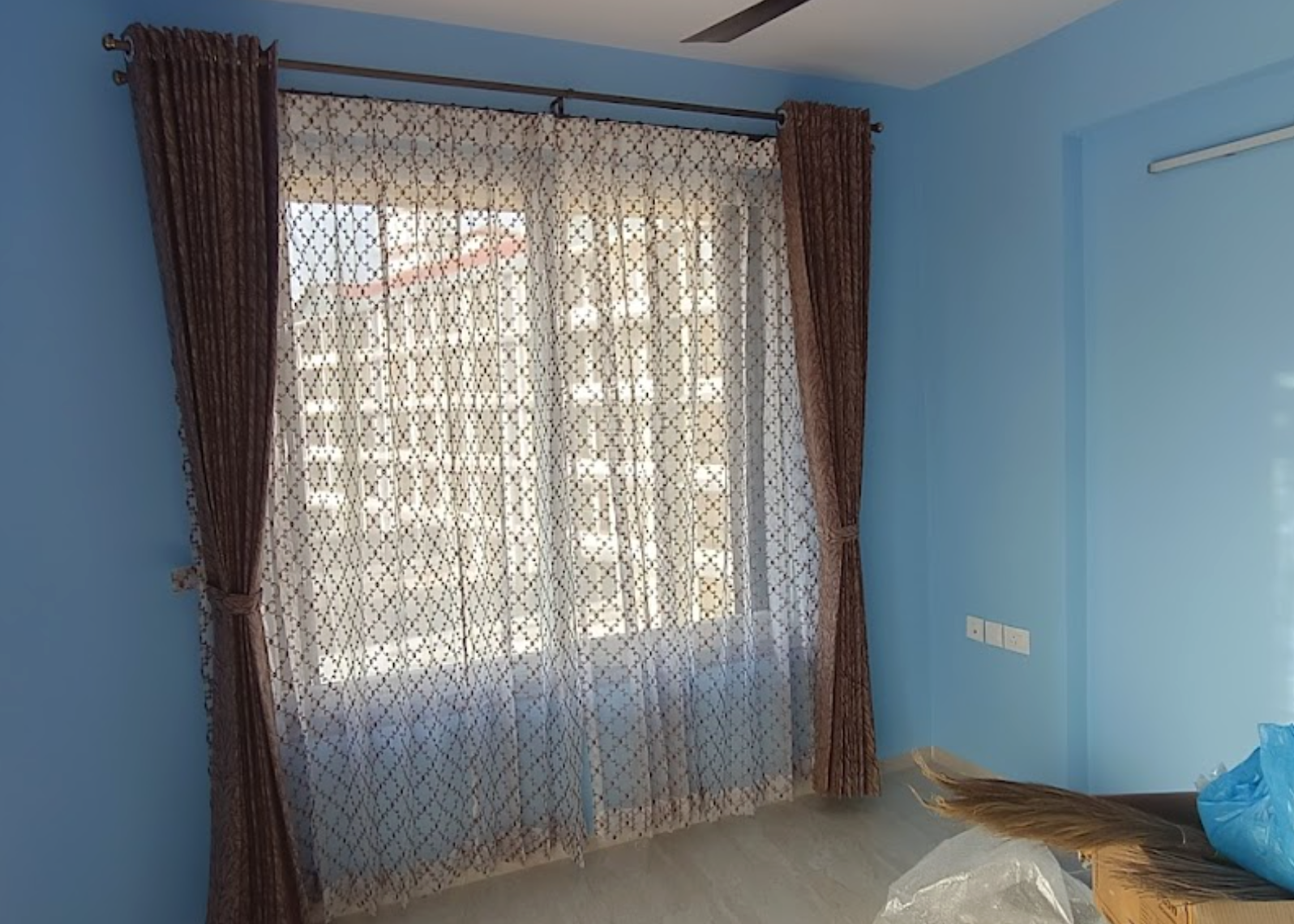 Sheer Patterned Pinch Pleat Curtains crafted for Goa interiors