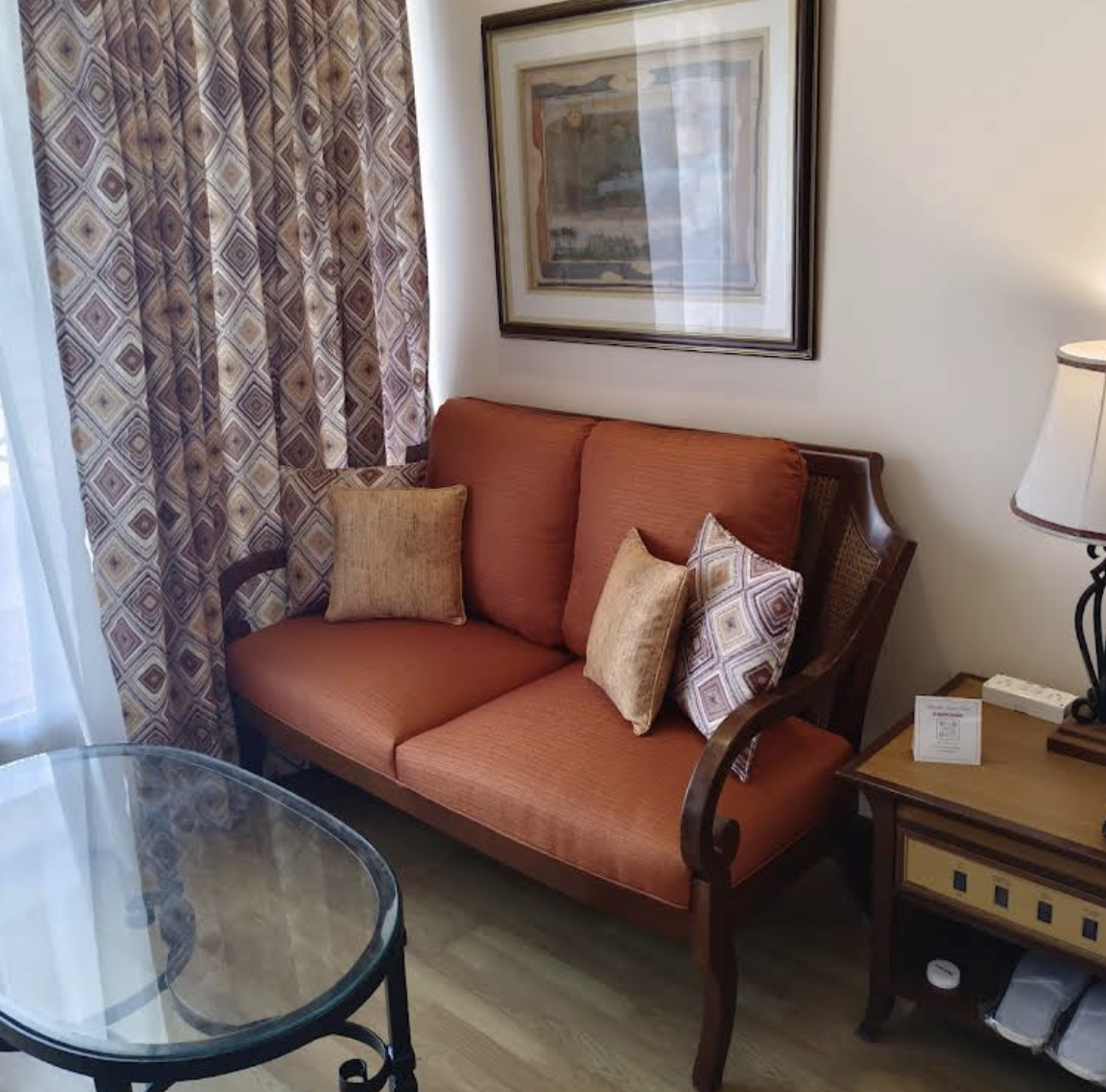 Brown Upholstered Sofa with Cane Sides